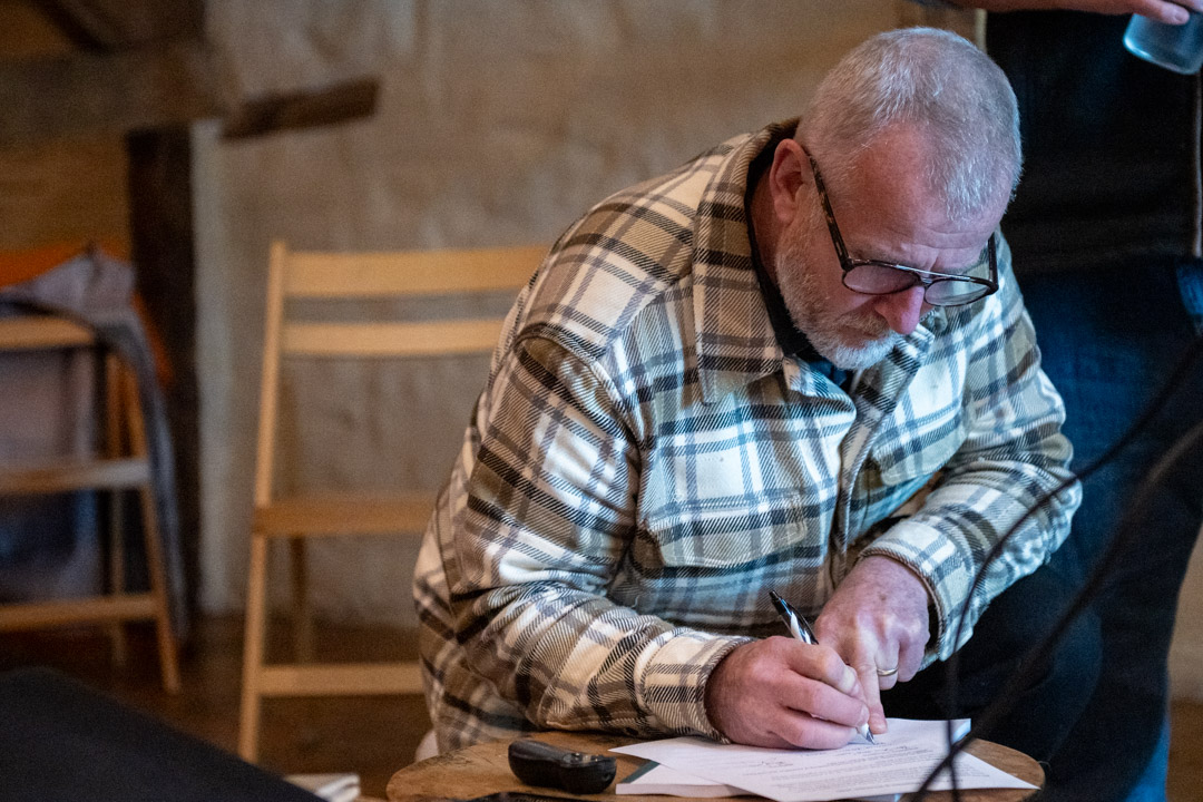 Mark Collins signing the constitution.
